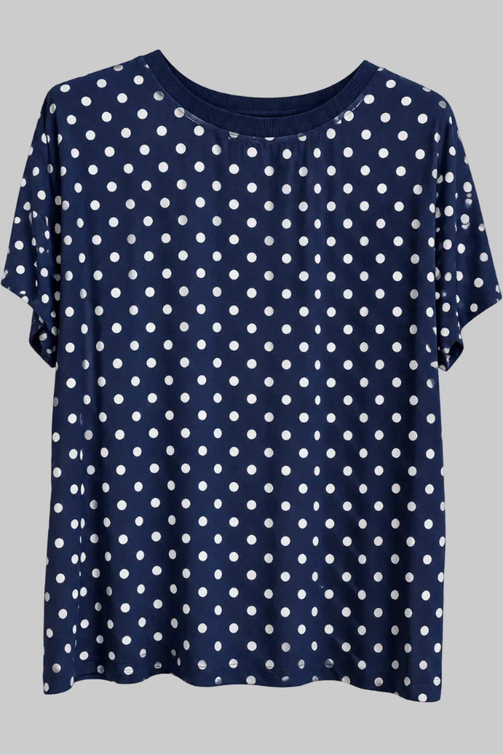 Haut fluide bleu marine à pois blancs