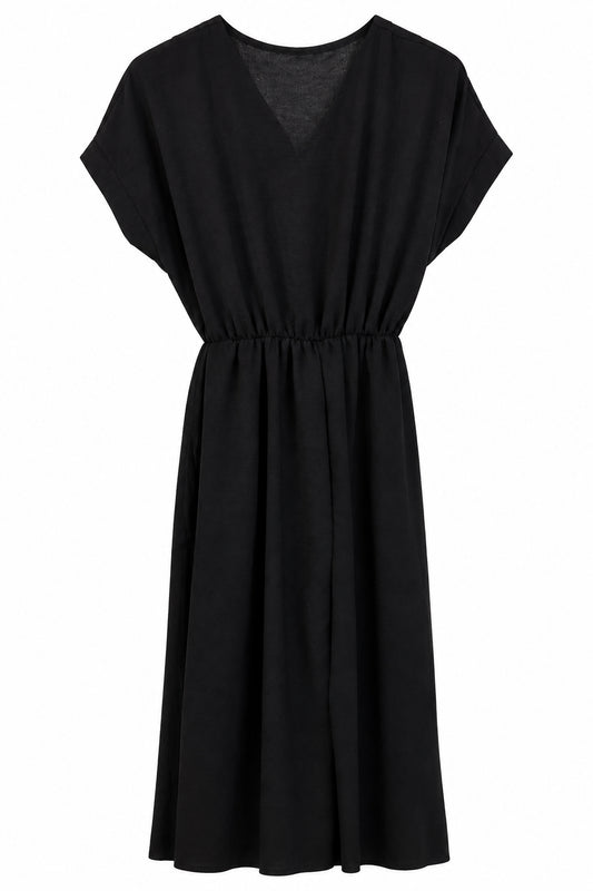 Combinaison pantalon noire fluide à col cache-cœur et ceinture à nouer