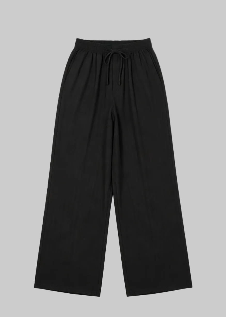 Pantalon fluide large noir à taille élastique et lien de serrage
