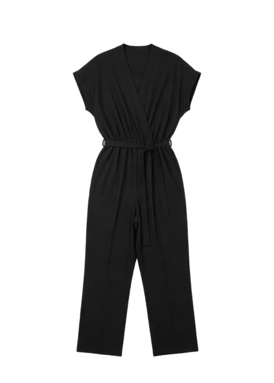 Combinaison pantalon noire fluide à col cache-cœur et ceinture à nouer